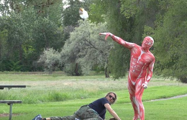 Man Eating Hamburger Attacked By Meat-Suit Wearing Vegetarian